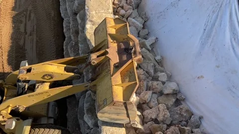 Yellow Loader CAT big bucket with stones, boulders. Stock Footage 227147090