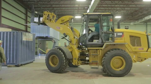 Yellow Loader Raising Storage Container On Construction Site Stock Footage 46592174