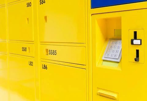 Yellow lockers doors with electric code locks Stock Photos