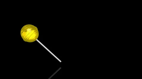 Yellow Lollypop turns on itself - loop animation - black background Stock Footage 255459943