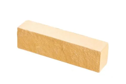 Yellow long relief ceramic brick at the white background, isolated Stock Photos