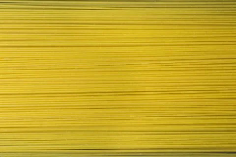 Yellow long spaghetti full screen. Stock Photos