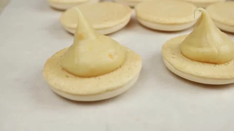 Yellow Macarons halves with cream, closeup Vídeos de archivo 62426311
