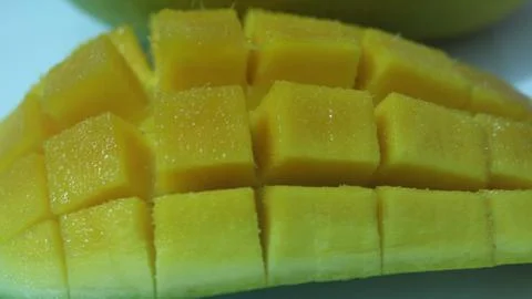 Yellow mango fruit slice cut into cubes is sweet and fresh 写真素材