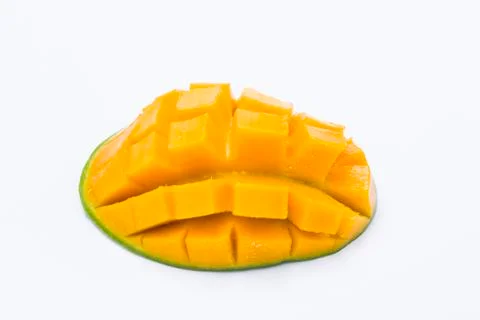 Yellow mango slice cut to cube isolated on white Stock Photos