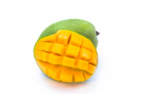 Yellow mango slice cut to cube isolated on white Stock Photos