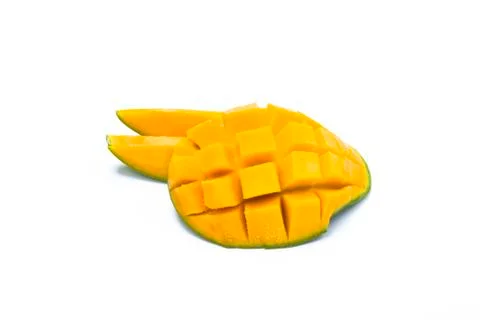 Yellow mango slice cut to cube isolated on white Stock Photos