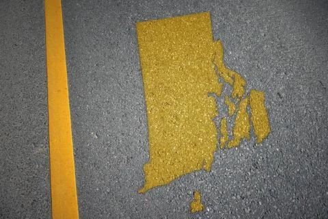 Yellow map of rhode island state on asphalt road near yellow line. Stock Photos