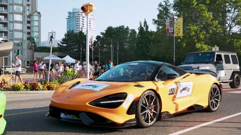 Yellow McLaren Pulling up to a Stop on the Street Stock Footage 305242010