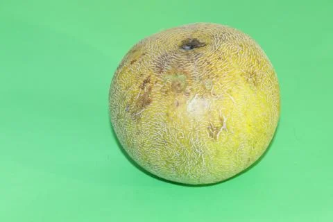 Yellow melon on a green background Stock Photos