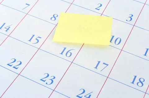 Yellow memo note on a calendar Stock Photos