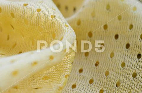 Yellow mesh sport wear fabric textile background pattern Stock Photos