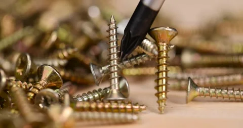 Yellow metal self tapping screws for fastening are used in construction, self Stock Footage 300420756