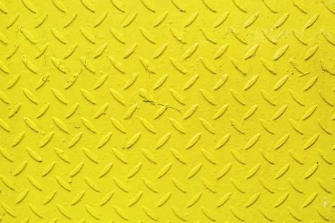 Yellow metal texture with a pattern in the form of lines and petals Stock Photos