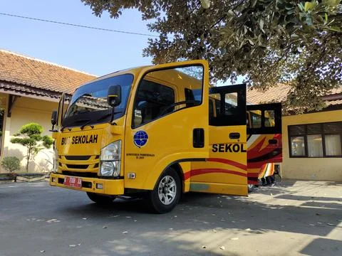 A yellow mini bus is seen from the side with the door open and it says "Bus.. Stock Photos