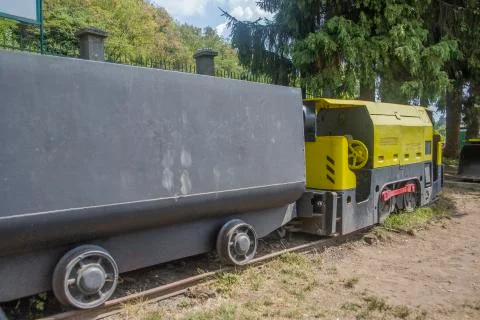 Yellow mining train with wagon on exposition in museum Stock Photos