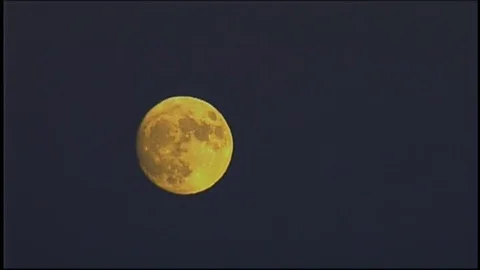 Yellow moon in grey sky Stock Footage 78816853