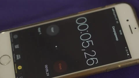 Yellow nail presses the start button of the stopwatch Stock Footage 300867211