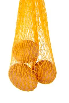 Yellow net with three eggs Stock Photos
