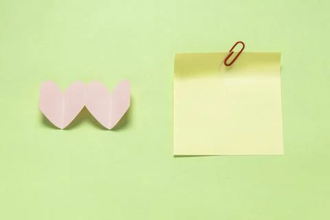 A yellow note on a green background Stock Photos