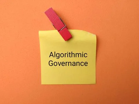 A yellow note labeled Algorithmic Governance is clipped with a red wooden c.. Stock Photos