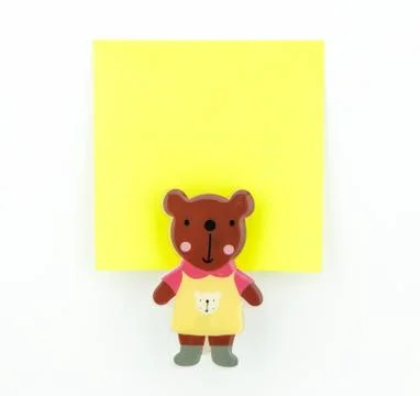 Yellow note pad with bear clip Stock Photos