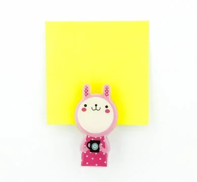 Yellow note pad with pink rabbit clip Stock Photos