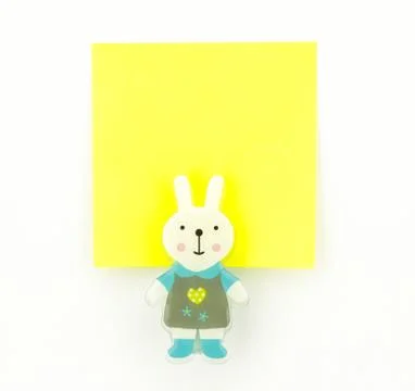 Yellow note pad with rabbit clip Stock Photos