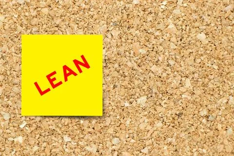 Yellow note paper with word lean on cork board background with copy space Stock Photos