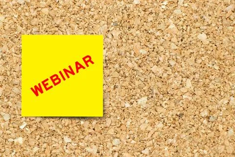 Yellow note paper with word webinar on cork board background with copy space Stock Photos
