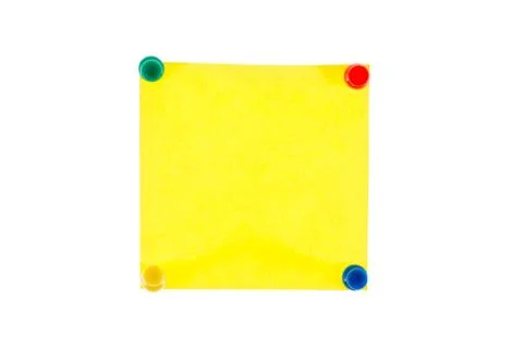 Yellow note with pins on white background 写真素材