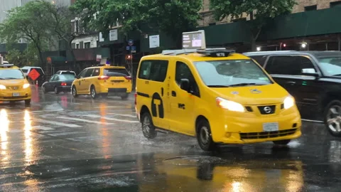 Yellow NYC Taxi Cabs navigate city Stock Video Pond5