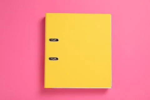 Yellow office folder on pink background, top view Stock Photos