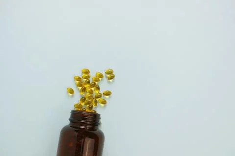 Yellow omega 3 capsule pattern. Different gold pills. Medical horizontal bann Stock Photos
