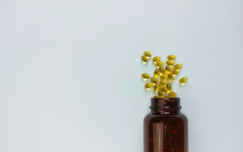 Yellow omega 3 capsule pattern. Different gold pills. Medical horizontal bann Stock Photos
