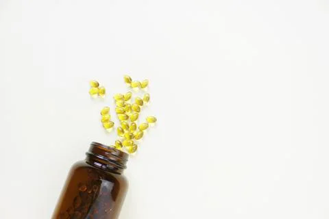Yellow omega 3 capsule pattern. Different gold pills. Medical horizontal bann Stock Photos