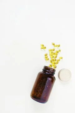 Yellow omega 3 capsule pattern. Different gold pills. Medical banner. Cosmeto Stock Photos