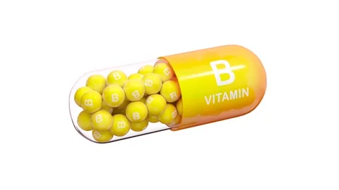 Yellow-orange pill or capsule filled with vitamin B. Seamless loop. Stock Footage 253631497