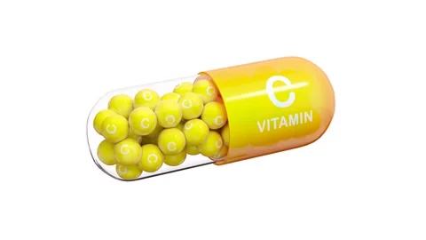 Yellow-orange pill or capsule filled with vitamin C. Seamless loop. Stock Footage 253631499