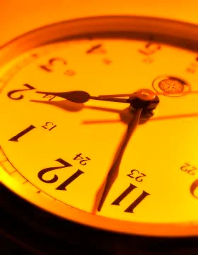 YELLOW ORANGE RED CLOCK FACE Stock Photos