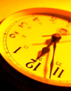 YELLOW ORANGE RED CLOCK FACE Stock Photos