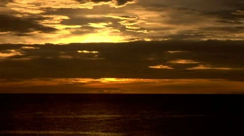 Yellow Orange Sky Dark Ocean Sunset time lapse Stock Footage 22159726