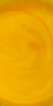 Yellow-orange surface of pumpkin soup Stock Photos