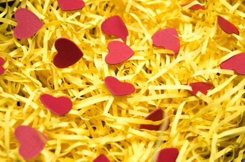 Yellow packaging material and red heart model Stock Photos