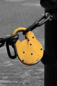 Yellow Padlock replacing a broken link Stock Photos