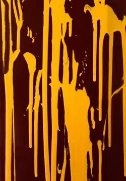 Yellow paint on a dark background Stock Photos