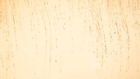 Yellow paint dissolves in liquid, process Stock Photos