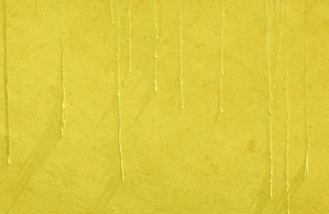 Yellow paint drip wall texture background Stock Photos