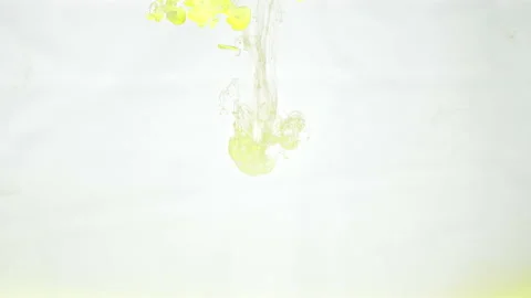 Yellow paint flows spread Stock Footage 165502617