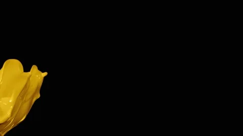 Yellow paint splash thrown in slow motion, liquid isolated on black (4K) Stock Footage 137111900